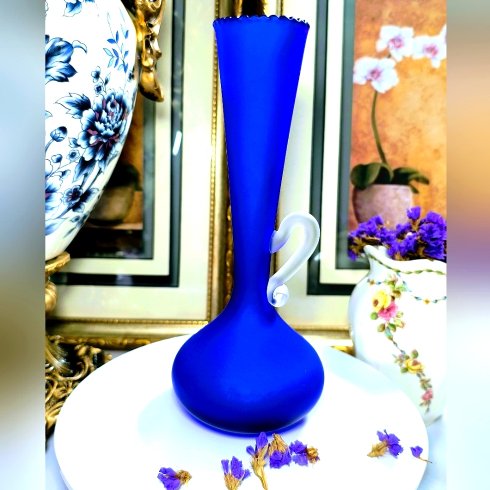 unique antique cobalt blue glass vase with handle from the 1930s.  I'm not sure
